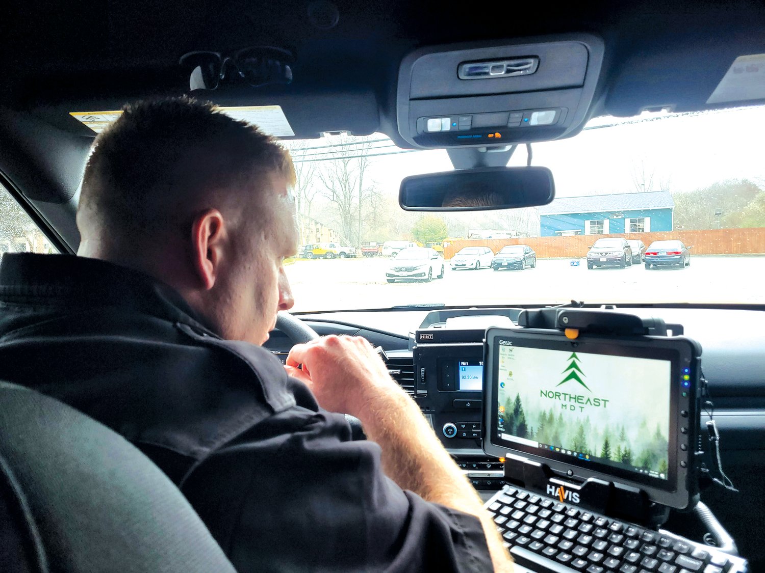 FIXED POST: Johnston Police Officer Matt Leveillee watches for signs of distracted and/or impaired driving while on a traffic post along Hartford Avenue.